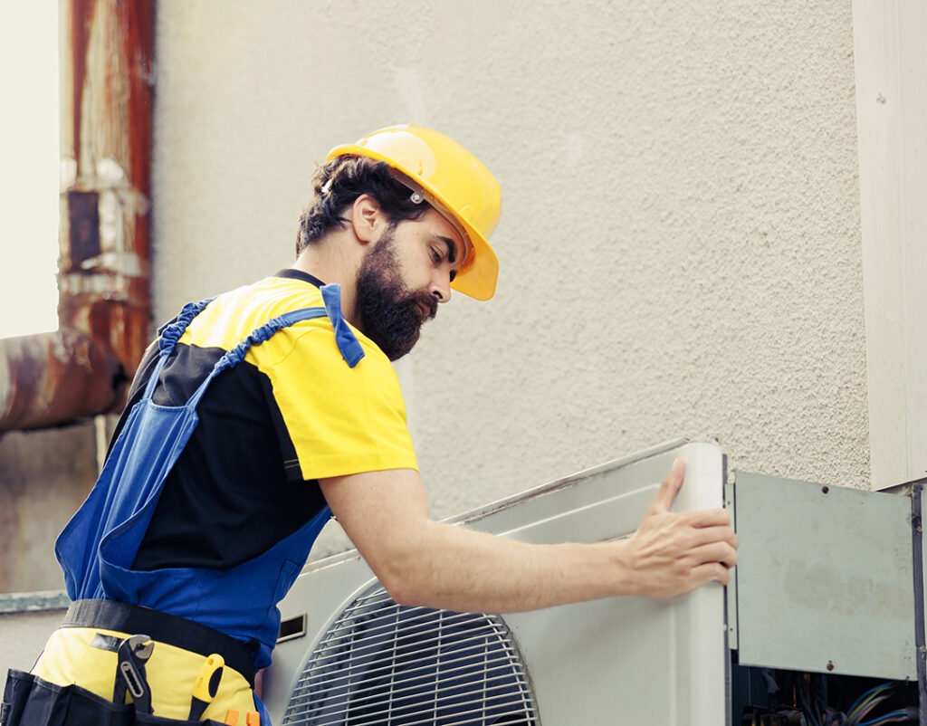 Technician Fixing Air Conditioner